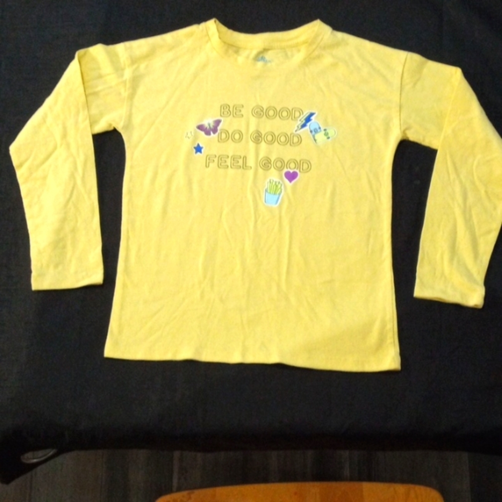 The color is yellow and is a very cute top for girls.
